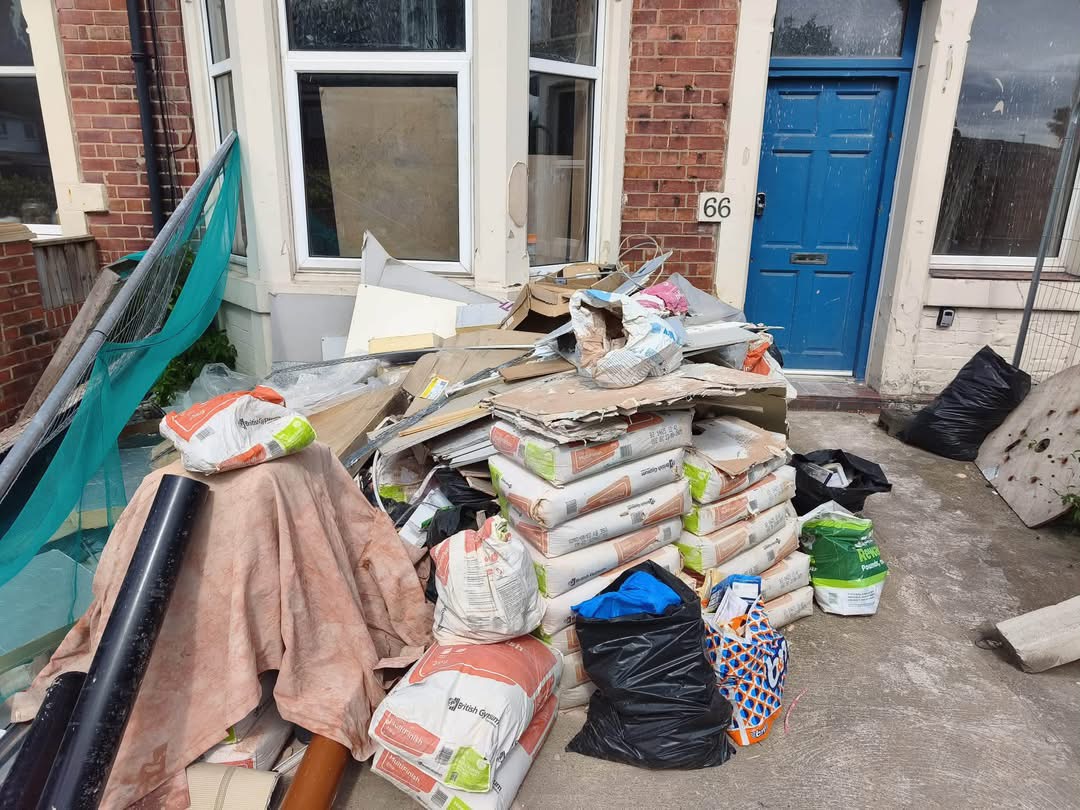 Builders waste piled on a driveway before clearance in Wallsend
